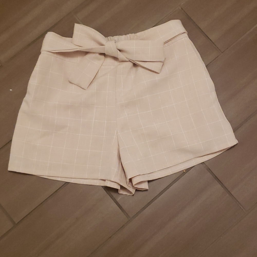Tan and white shorts